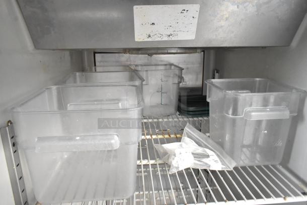 Hoshizaki CF1B-FS commercial freezer interior with clear storage bins. Some wear visible. Runs on 115 volts, 1 phase.