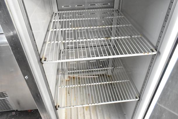 Hoshizaki CF1B-FS commercial single door reach-in freezer, interior with wire shelves, 115 volts, 1 phase, showing wear.