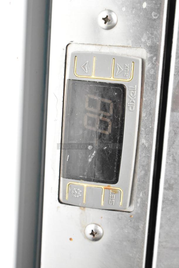 C Nelson BS 2 Commercial Chest Freezer, 115 Volts, digital display, visible rust marks, stainless steel control panel.