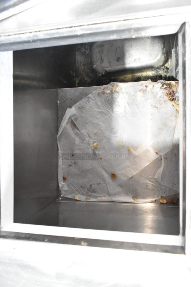 C Nelson BS 2 Commercial Chest Freezer interior, used condition, 115V, 1 Phase; features some visible wear and debris.