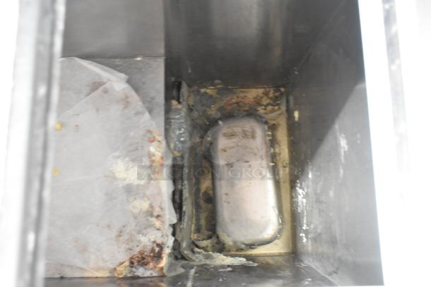 C Nelson BS 2 Commercial Chest Freezer interior, showing signs of wear and residue. 115 Volts, 1 Phase.