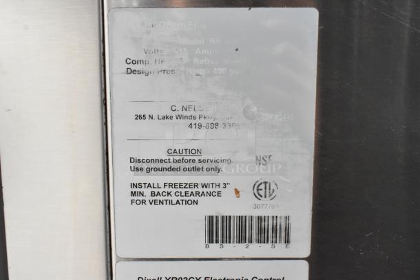 C Nelson BS 2 Commercial Chest Freezer label; 115 volts, 1 phase; caution and installation guidelines visible.