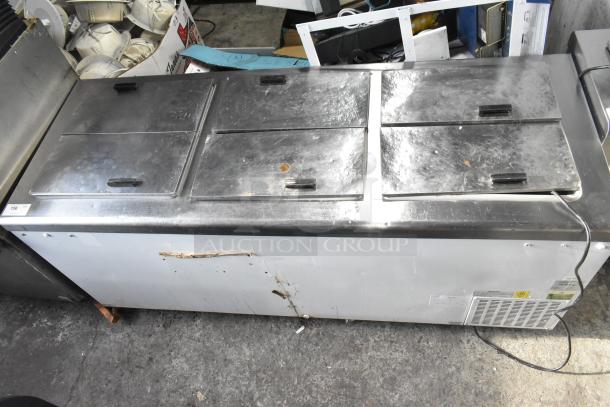 Excellence HFF-12-HC commercial chest freezer with 3 center hinge lids, shows wear. 115 volts, 1 phase.