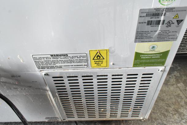 Excellence HFF-12-HC commercial chest freezer with 3 center hinge lids, 115V, 1 phase. Labels warn of electric installation and fire risk. Environmentally friendly model.