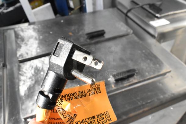 Excellence HFF-12-HC commercial chest freezer with 3 center hinge lids, 115 volts, includes caution tag and grounding plug.