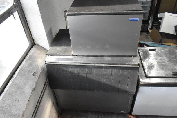 Koolaire ice maker on Hoshizaki B-700PD bin, steel exterior, used condition, visible Koolaire label.