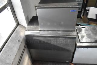 Koolaire ice maker on Hoshizaki B-700PD bin, steel exterior, used condition, visible Koolaire label.