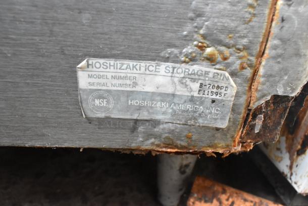 Koolaire ice bin head on Hoshizaki B-700PD, seen with a metal label showing wear and rust, model and serial numbers visible.