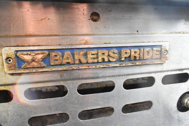Bakers Pride gas-powered flat top griddle, commercial countertop model, visible wear, branded metal label.
