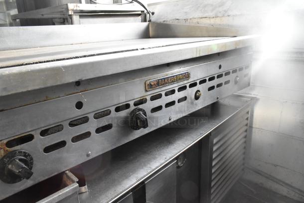 Bakers Pride commercial countertop gas griddle, showing control knobs, ventilation slots, and brand label, in used condition.