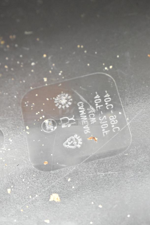 Label on Commercial 2 Drawer Chef Base, showing voltage, safety, and recycling symbols. Surrounded by minor debris.