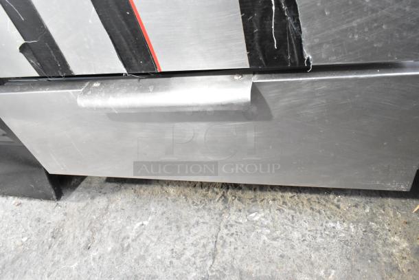 Commercial 2 Drawer Chef Base, stainless steel, sturdy handle, minor wear, ideal for kitchen storage.