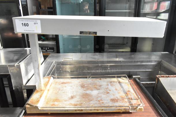 Hatco countertop food warmer, 120 volts, 1 phase, showing visible wear and rust on the warming tray, auction tag attached.