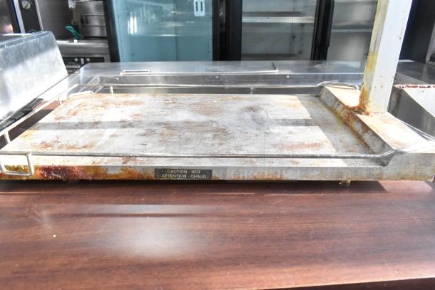 Hatco countertop food warmer, 120 volts, 1 phase. Visible wear and rust. "Caution: Hot" label in front.