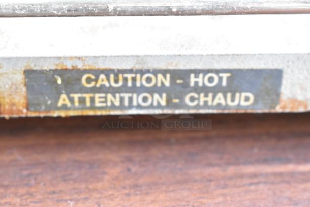 "Hatco Countertop Food Warmer with caution label, 120 volts, 1 phase. Used condition, surface wear visible."