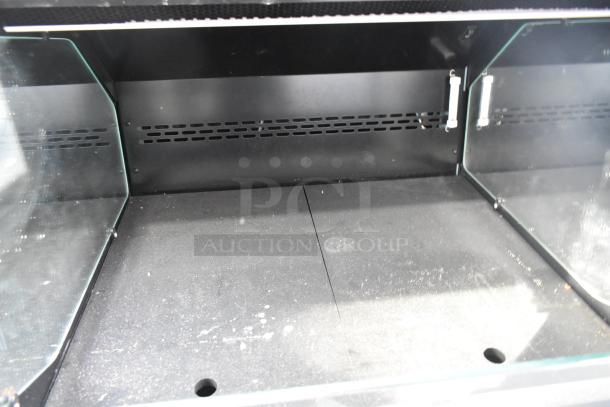 Structural Concepts grab-n-go merchandiser. Features glass sides, black interior, good condition with minor surface marks.