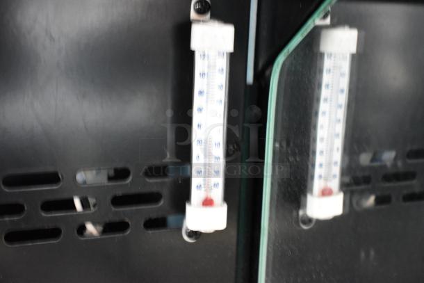 Thermometer inside Structural Concepts commercial grab-n-go merchandiser, showing temperature gauge against black vented panel.