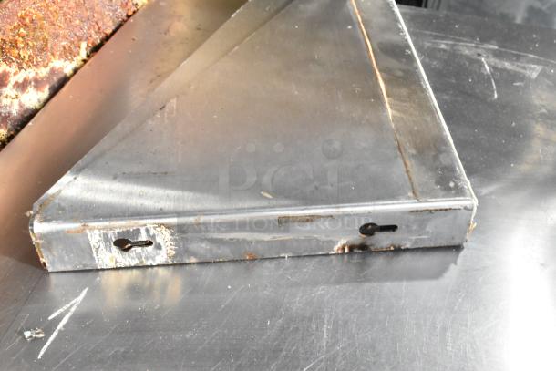 Metallic corner of Delfield UC4048P-STAR undercounter cooler with visible rust and wear, showcasing its used condition.