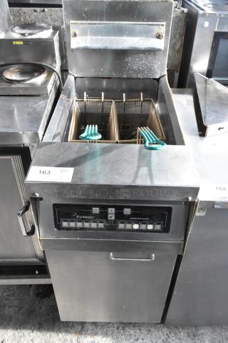 Frymaster commercial floor fryer with two metal fry baskets, control panel, and stainless steel body. Used condition.