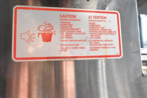 Bloomfield 8571 3 Burner Coffee Machine, 120V, 1 Phase. Caution label advises on decanter use and hot contents.