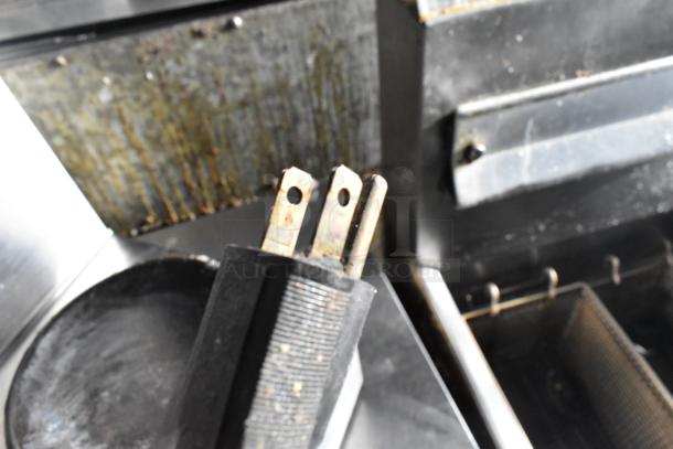 Close-up of a power plug for Bloomfield 8571 Countertop 3 Burner Coffee Machine. 120 Volts, 1 Phase. Visible wear.