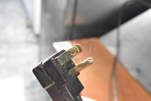 Power plug for Silver King SKRCF Commercial Countertop Refrigerated Rail, 115 Volts, 1 Phase. Visible wear on metal prongs.