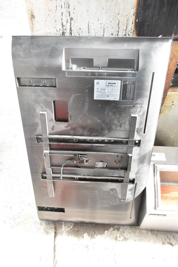 Samsung BE43D-H 43" TV, rear view, 110-127V, 1 phase, visible mounting brackets and labels. Buyer must pick up.