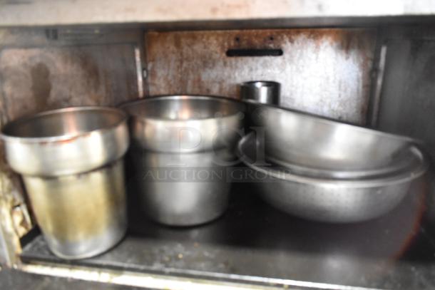 Vulcan commercial gas 6-burner range with oven, over shelf, and backsplash; stainless steel finish, good condition.