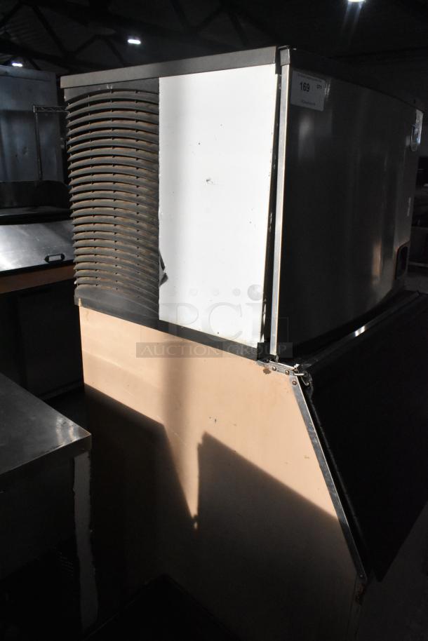 Manitowoc commercial ice machine head on bin, stainless steel, good condition, visible label with model number.