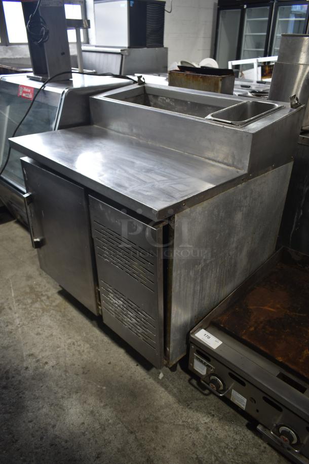 Migali commercial pizza prep table, stainless steel, 115 volts, 1 phase, showing prep area and storage. Good condition.
