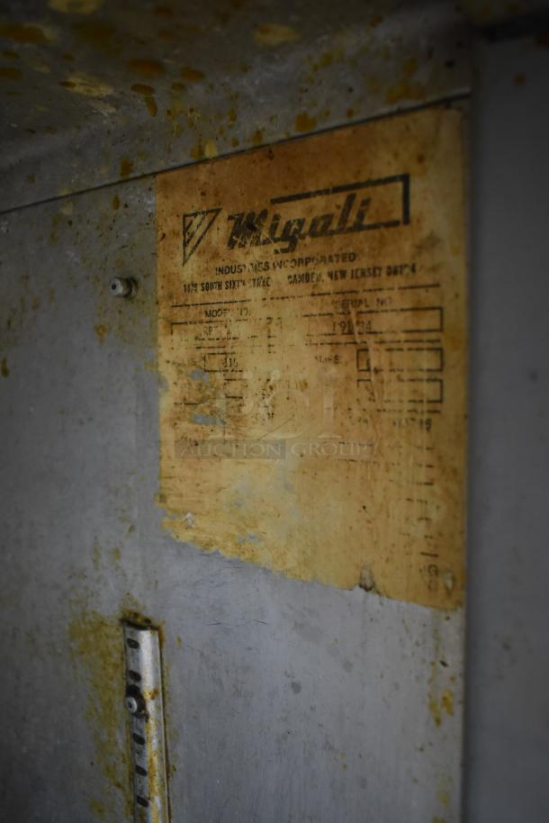 Migali Commercial Pizza Prep Table label showing model and serial numbers, indicating wear and use. 115 Volts, 1 Phase.