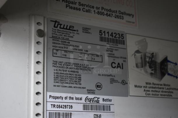 True GDM-49 cooler label detailing 115 volts, 1-phase specs, serial number 5114235, NSF certified for packaged products.