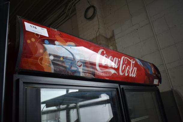 True GDM-49 Commercial Cooler Merchandiser, double glass doors, Coca-Cola branding, visible wear, 115V, auction tag 176.