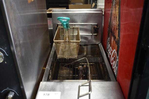 Frymaster PH155CSD commercial gas fryer with 2 metal baskets, 105,000 BTU. Used condition, visible wear and cleaning needed.