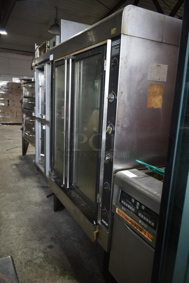 Hobart HGR06 commercial natural gas rotisserie oven. Stainless steel, control knobs, glass doors, used condition.