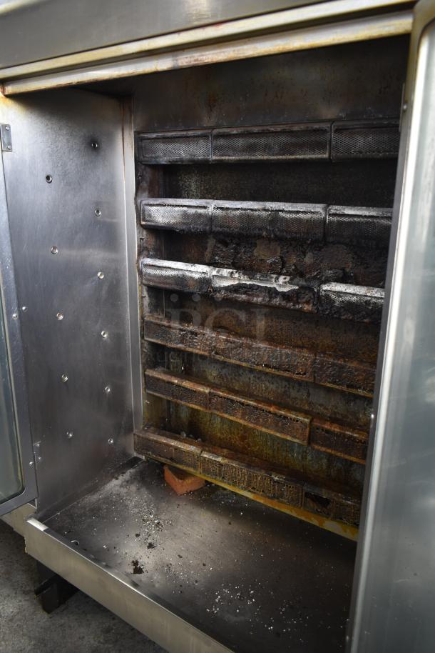 Hobart HGR06 commercial rotisserie oven, natural gas powered, interior view showing wear and rust, stainless steel body.