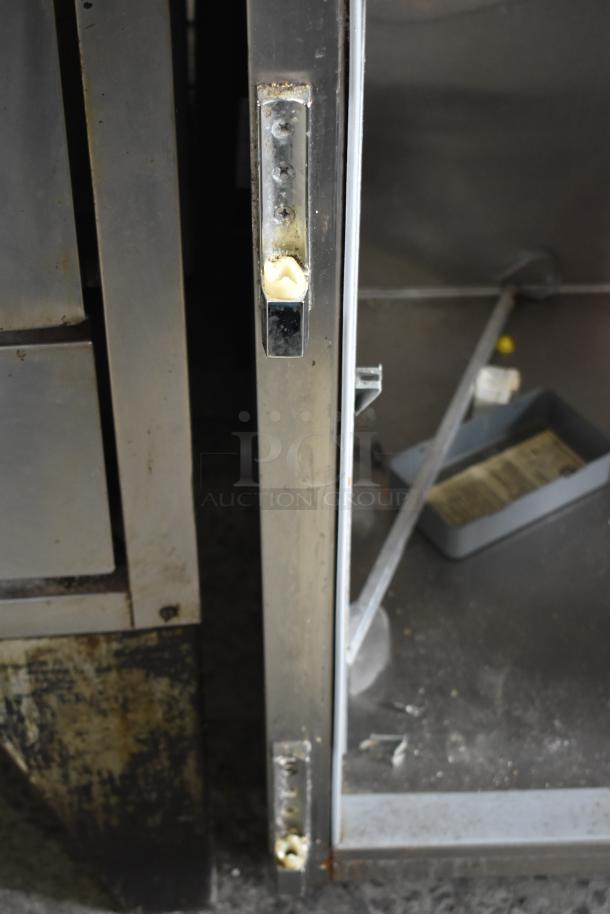 Beverage Air PF48-1AHS reach-in cooler shell, missing doors, stainless steel exterior, 115V, 1 phase, visible latch mechanism.