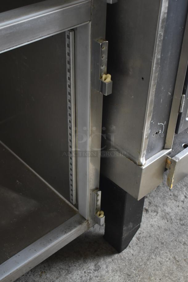 Beverage Air PF48-1AHS commercial cooler, missing doors, 115V, 1 phase. Interior shelf bracket visible. Used condition.