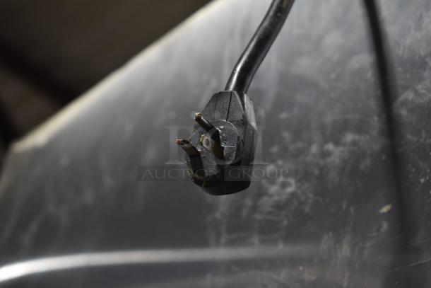 Close-up of a power plug for Beverage Air PF48-1AHS commercial cooler, missing doors, 115 volts, 1 phase.