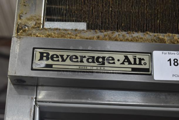 Beverage Air PF48-1AHS commercial cooler label. Stainless steel frame shows wear and missing doors. 115V, 1 Phase.