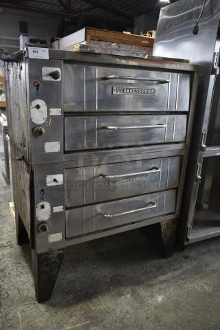 Bakers Pride commercial gas pizza oven, dual-deck, stainless steel, model details visible, used condition, auction tag marked "181".