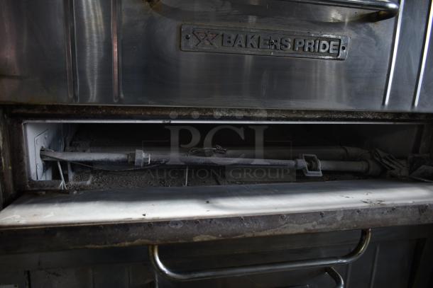 Bakers Pride commercial gas pizza oven, single deck, metal exterior, visible wear, branded logo plate.