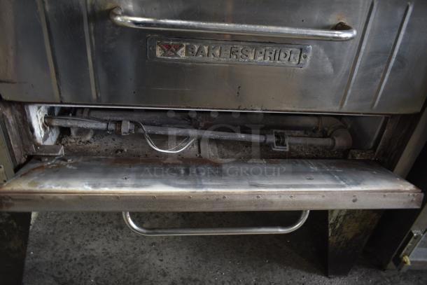 Bakers Pride commercial gas pizza oven with metal handle and visible gas connector, in used condition.