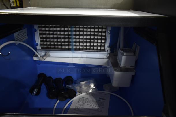 Brand new Avantco 194UCF280A commercial undercounter ice machine, 299 lb capacity, 115V, 1 phase. Visible components and manual included.