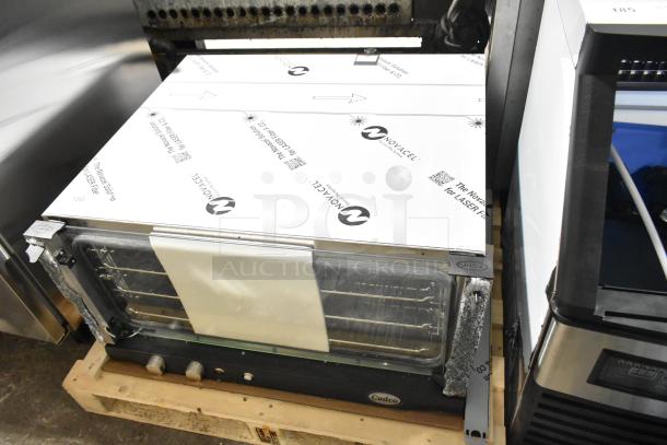BRAND NEW 2025 Unox Cadco XAFT183-US convection oven, 208-240V, 1 Phase. Note: Broken glass visible on the door.