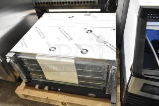 BRAND NEW 2025 Unox Cadco XAFT183-US convection oven, 208-240V, 1 Phase. Note: Broken glass visible on the door.