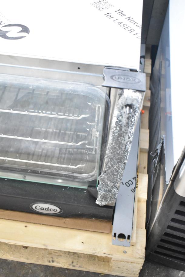 Brand new Unox Cadco XAFT183-US countertop convection oven, scratch and dent; broken glass visible, 208-240V, 1 phase.