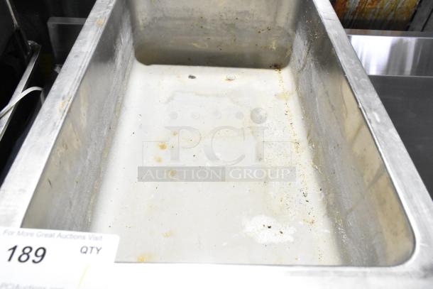 Qualite RDFW-1200NP Countertop Food Warmer, 120V, showing signs of wear, empty tray, auction tag visible.