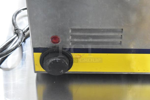 Qualite RDFW-1200NP Countertop Food Warmer, 120 volts, 1 phase. Features temperature dial, indicator light, metal exterior.