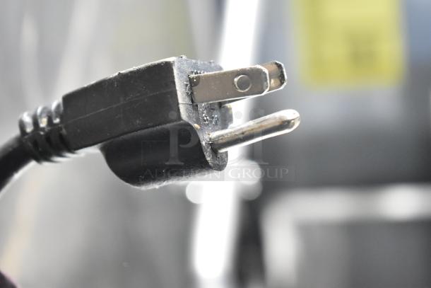 Close-up of a power plug for the Qualite RDFW-1200NP countertop food warmer, 120 volts, 1 phase.